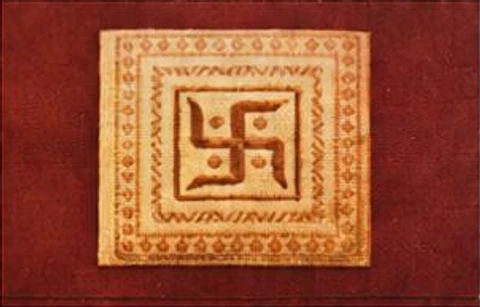 Manuscript illustration: ornamental gold tile on a red background